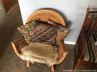 Front view of bamboo and wicker armchair with cushions showing seat and armrests