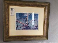 Framed print showing tree branches with visible signature and edition number.