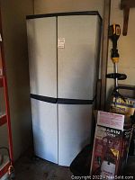 Front view of closed plastic storage cabinet showing exterior condition and design.