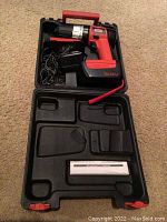 Jobmate cordless drill with battery, charger, and carrying case