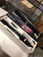 Telescope tube and tripod in original box with space-themed design and Meade logo