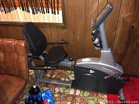 Side view of entire bike showing frame, seat, console and pedals