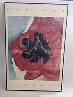 Front view of the framed poster showing the red poppy artwork and O'Keeffe name at top.