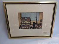 Framed print showing an interior scene with bench, stove, and chair in muted tones with checkerboard floor and wood panel walls.