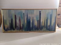 Front view of full framed painting showing entire abstract cityscape