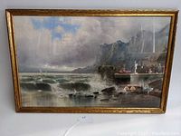 Frontal view of the framed pastel seascape depicting waves, rocky shoreline, and a cloudy sky with birds.