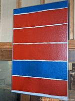Full view of entire painting showing alternating red and blue horizontal bands