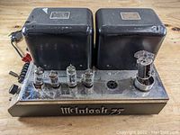 Front view of chassis showing transformers, tube sockets, and McIntosh 75 logo