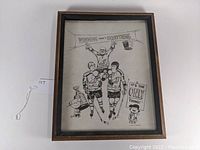 Framed black and white illustration showing full hockey scene with Charlie Brown and Lucy characters, signed by Perez.