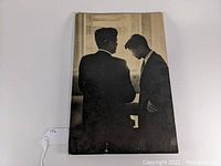 Front view of the vintage black and white photograph featuring John F. Kennedy and Robert F. Kennedy, mounted on studio board.