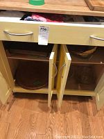 Open cupboard doors revealing storage of several woven placemats and additional oven-to-tableware bakeware dishes.