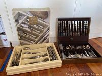 Lenox flatware caddy and GoldWorks wooden box containing Oneida flatware, full lot view