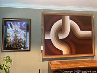 Two framed artworks mounted together: Teamwork poster and abstract canvas