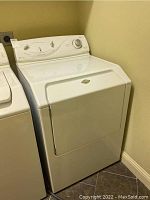 Front and angle view of Maytag Intellidry dryer, white finish, showing control panel and door.