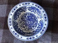 Top view of the large bowl showing detailed blue dragon and floral patterns inside.