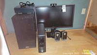 Full lot view: AVA tower, BenQ monitor, UPS, Logitech speakers, webcam