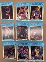 Photo showing 9 basketball stickers including Charles Oakley, Alex English, Patrick Ewing, Larry Bird, Mark Aguirre, Dominique Wilkins, Isiah Thomas, Kevin McHale, and Magic Johnson.