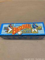 Blue Donruss baseball card box with 'Puzzle & Cards' labeling and baseball player illustrations visible on top.