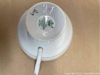 Underside view of a bone china tea cup showing the Arcadian England mark and item number 3579.
