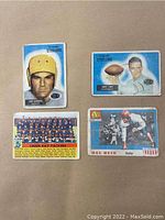 Four vintage football cards from the mid 1950s with fronts shown, two Steelers players, one full Packers team photo, and Melvin Hein card with blue background elements.