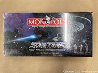 Front of sealed Monopoly game box featuring Star Trek The Next Generation graphics and logo.