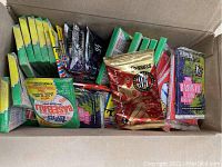 Box containing a variety of unopened vintage baseball card packs from multiple brands and styles including wax and foil packs.