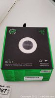 Front of box featuring Razer KIYO webcam with ring light image and product branding.
