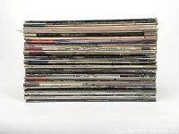 Stack of 41 1980s LP vinyl records shown from side, showing condition of album spines