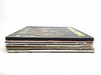 Side view of stacked 7 classical LP records showing titles on spines including 'Classical Music Masterpieces', '120 Music Masterpieces 1', and 'The Work Of Ballet Vol. 2'. Shows the general condition of the sleeves and thickness of the lot.