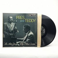 Front cover of the album "Pres and Teddy" featuring a black and white photo of Lester Young and Teddy Wilson with the record partially inside its original sleeve.