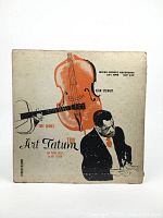 Front cover of the 10 inch vinyl LP album titled 'Tiny Grimes Trio' featuring illustration of double bass and pianist.