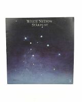 Front cover of Willie Nelson Stardust vinyl record album with night sky and stars artwork.