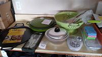 Overview of all cookware and accessories on kitchen counter