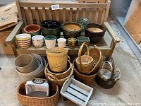 Front view of wooden bench displaying all pots and baskets