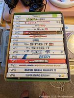 Stack of 20 Wii game cases showing game titles