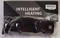 Photo of black rechargeable heated sock in original plastic packaging with Intelligent Heating branding on box
