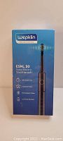 Photo of the Wepklin ESNL 50 Sonic Electric Toothbrush packaging showing product features and design.