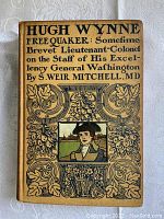 Front cover of the 1908 book Hugh Wynne Free Quaker showing illustrated and decorative front board design.