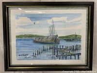 Framed watercolor painting showing schooner and docks, signed Bill Paxton lower left.