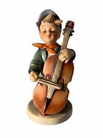 Front view of Sweet Music Hummel figurine showing boy playing cello with bow, detailed facial expression and costume.