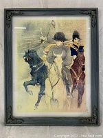 Frontal photo showing the entire framed lithograph depicting Napoleon and two other riders on horseback, set against a textured background.