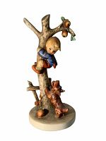 Front and angled side view of the vintage Hummel figurine showing boy stuck in tree and dog looking up.