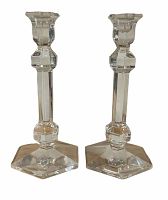 Pair of clear crystal Val St Lambert candlesticks showing geometric faceted stems and hexagonal bases, standing upright.