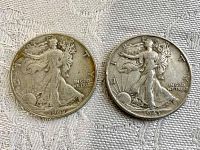 Obverse view of 1943 and 1947 Walking Liberty half dollar coins side by side.