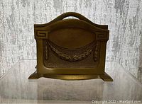 Front view of the bronze letter organizer showing Art Deco decorative details and handle