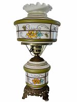 Full front view of tall vintage painted glass lamp with floral painted glass sections, ruffled white glass top shade, and ornate metal base.