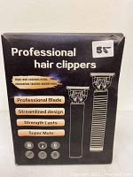 Photo of the box for Professional Hair Clippers showing features such as professional blade, streamlined design, strength lasts, super mute, and icons for rechargeable, 4 adjustable heads, and USB charging.