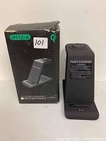 3-in-1 wireless charging station with box showing product image and model info, black device with charging surfaces for Apple Watch, iPhone, and iPad.