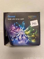 Front of box for Govee RGB LED Strip Light with colorful LED strip image and features noted such as warm white, cool daylight, and 16 million colors.