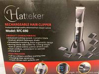 Box front showing Hatteker rechargeable hair clipper model RFC-690 with product characteristics such as ceramic blade, cordless operation, 0.5mm to 2.5mm adjustable length, waterproof, 2.5 hour cordless working time